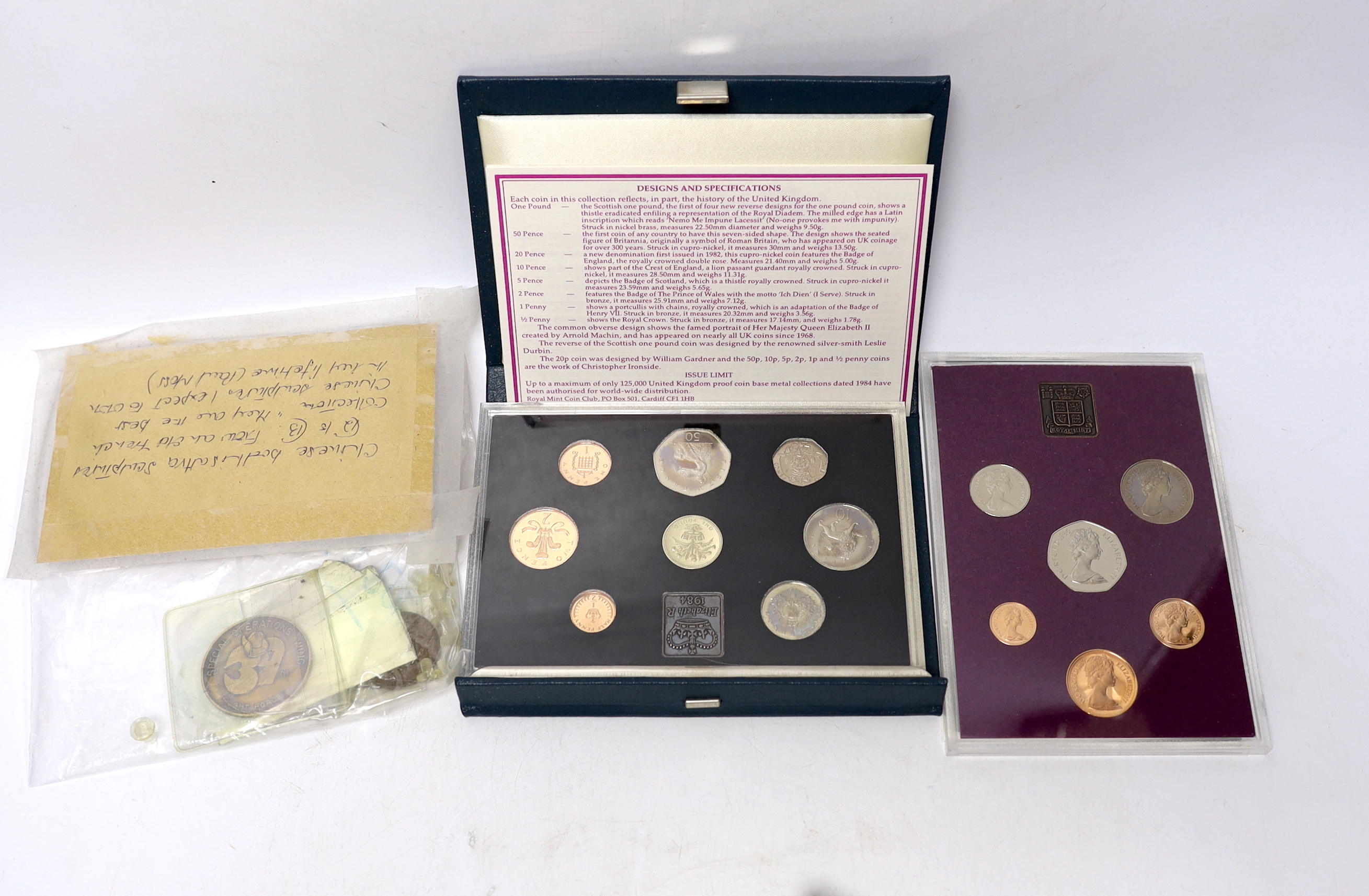 A National Service medal, various Royal Mint proof or BU coin sets etc.